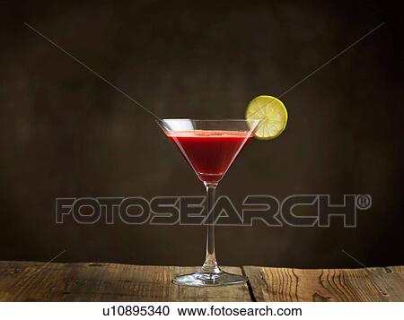 Raw juice in cocktail glass garnished with lime slice View Large Photo Image Stock Image - Raw juice in cocktail glass garnished with lime slice. Fotosearch