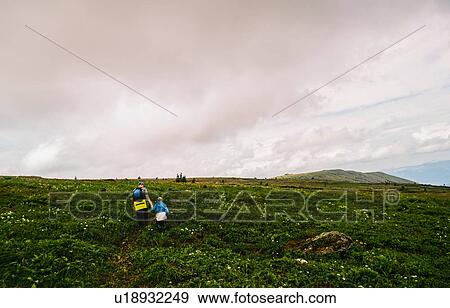 Rear view of father and daughter hiking in landscape, Ural Mountains, Russia View Large Photo Image Stock Photo - Rear view of father and daughter hiking in landscape, Ural Mountains, Russia. Fotosearch