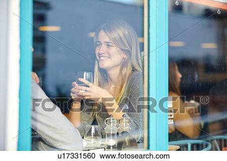 Romantic young couple at cafe having lunch date View Large Photo Image Stock Image - Romantic young couple at cafe having lunch date. Fotosearch