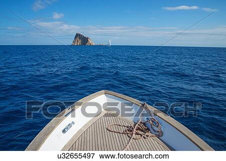 Sailing at Basiluzzo Cliff, Panarea, Aeolian Islands, Sicily, Italy View Large Photo Image Stock Photo - Sailing at Basiluzzo Cliff, Panarea, Aeolian Islands, Sicily, Italy. Fotosearch