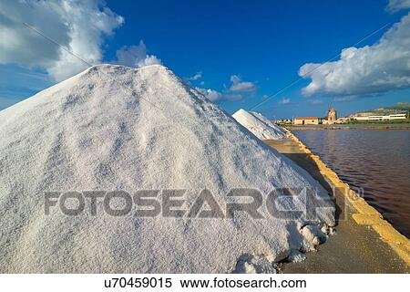 Salt stacks on salt pan waterfront, Trapani, Sicily, Italy View Large Photo Image Stock Photography - Salt stacks on salt pan waterfront, Trapani, Sicily, Italy. Fotosearch