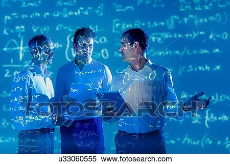 Stock Photography - Scientists with projected mathematical data. Fotosearch