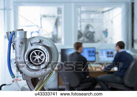 Scientists working at computers in turbo charger automotive research laboratory View Large Photo Image Stock Image - Scientists working at computers in turbo charger automotive research laboratory. Fotosearch