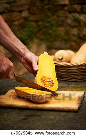 Senior mans hands chopping butternut squash with knife on cutting board View Large Photo Image Stock Photography - Senior mans hands chopping butternut squash with knife on cutting board. Fotosearch