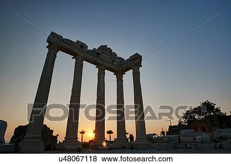 Stock Photo - Silhouetted Temple of Apollo at sunset, Antalya, Turkey. Fotosearch
