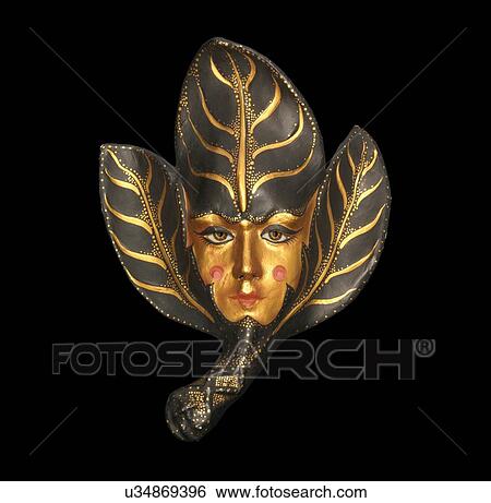 Sinister venetian mask with gold face and leaves on black background View Large Photo Image Stock Photograph - Sinister venetian mask with gold face and leaves on black background. Fotosearch