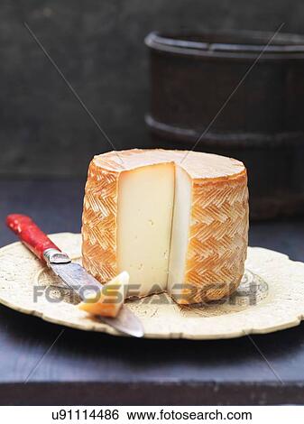 Stock Photograph - Sliced manchego cheese on plate. Fotosearch