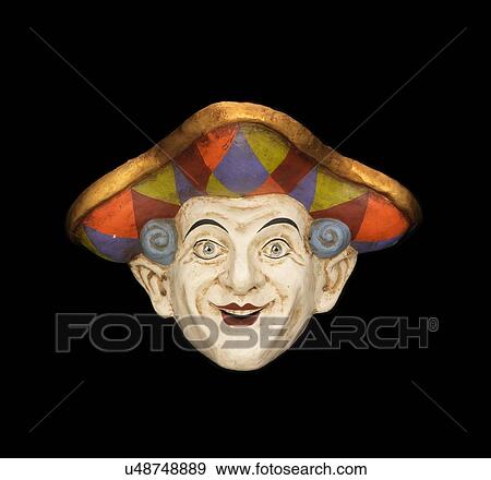 Stock Photo - Smiling venetian face mask with tricorn hat on black background. Fotosearch