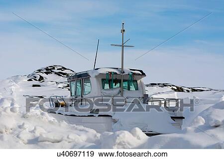 Snow covered boat at Ilulissat, Greenland View Large Photo Image Stock Photo - Snow covered boat at Ilulissat, Greenland. Fotosearch