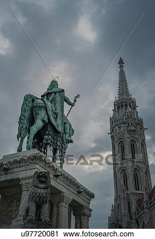 Stock Image - Statue of Saint Stephen and Matthias Church at dusk, Hungary, Budapest. Fotosearch