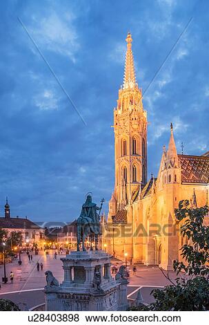 Stock Photo - Statue of Saint Stephen and Matthias Church at dusk, Hungary, Budapest. Fotosearch