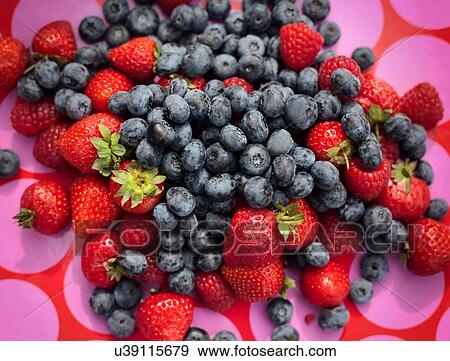 Strawberries and blueberries on patterned background View Large Photo Image Stock Photo - Strawberries and blueberries on patterned background. Fotosearch