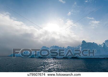 Picture - Sunlight and icebergs at Ilulissat icefjord, Disko Bay, Greenland. Fotosearch
