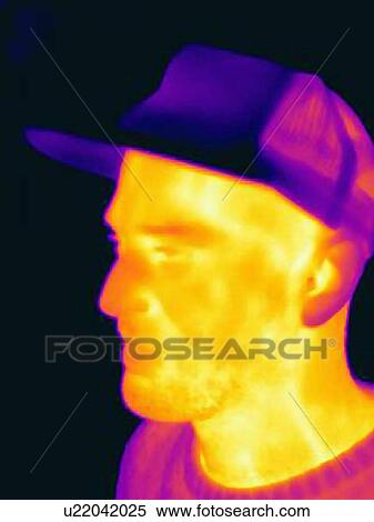 Thermal image of man wearing face mask and baseball cap View Large Photo Image Stock Photography - Thermal image of man wearing face mask and baseball cap. Fotosearch