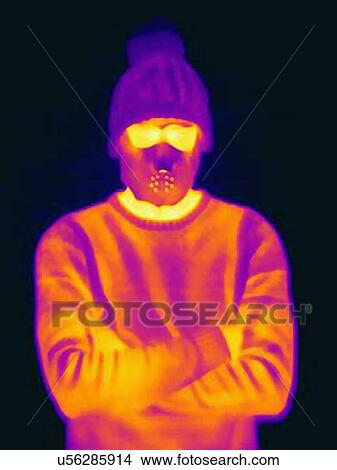 Thermal image of man with crossed arms wearing threatening mask and knit hat View Large Photo Image Picture - Thermal image of man with crossed arms wearing threatening mask and knit hat. Fotosearch