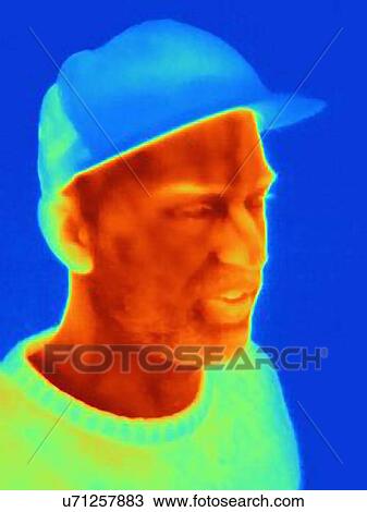 Thermal image of young man wearing face mask and baseball cap View Large Photo Image Stock Image - Thermal image of young man wearing face mask and baseball cap. Fotosearch