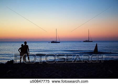 Tourists looking at sea view at dusk, Cefalu, Sicily View Large Photo Image Stock Photography - Tourists looking at sea view at dusk, Cefalu, Sicily. Fotosearch