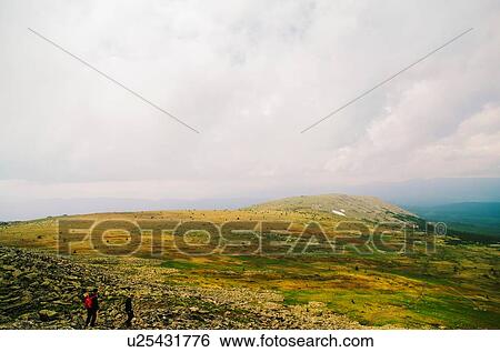 Stock Photograph - Two men hiking in Ural Mountains, Russia. Fotosearch