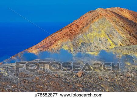 View of coast fumarole and sulphur smoke at Gran Cratere, Vulcano Island, Aeolian Islands, Sicily, Italy View Large Photo Image Stock Photo - View of coast fumarole and sulphur smoke at Gran Cratere, Vulcano Island, Aeolian Islands, Sicily, Italy. Fotosearch