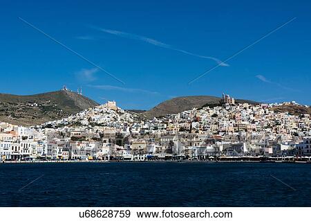 View of sea and Ermoupoli town, Syros, Cyclades Islands, Aegean sea, Greece View Large Photo Image Stock Photo - View of sea and Ermoupoli town, Syros, Cyclades Islands, Aegean sea, Greece. Fotosearch