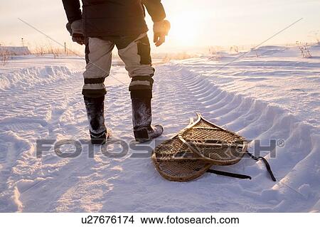 Waist down view of man in snow landscape at sunset, Ural, Russia View Large Photo Image Picture - Waist down view of man in snow landscape at sunset, Ural, Russia. Fotosearch