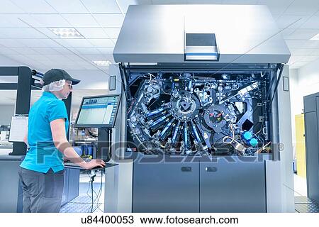 Worker with ink jet printer in food packaging printing factory View Large Photo Image Stock Image - Worker with ink jet printer in food packaging printing factory. Fotosearch