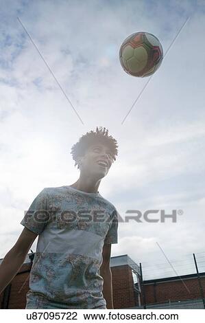 Young man practising football skills View Large Photo Image Stock Image - Young man practising football skills. Fotosearch