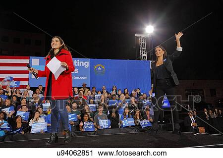 Stock Image - Actress Eva Longoria and Actress America Ferrera wave to attendees during a Hillary Clinton campaign rally at the Clark County Government Center Amphitheater in Las Vegas, Nevada. Fotosearch