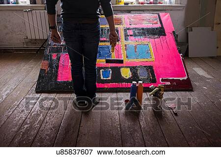 Stock Photo - Artist in his studio. Fotosearch