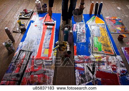 Artist painting on canvas View Large Photo Image Stock Image - Artist painting on canvas. Fotosearch