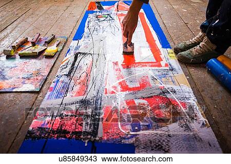 Artist painting on canvas View Large Photo Image Stock Image - Artist painting on canvas. Fotosearch