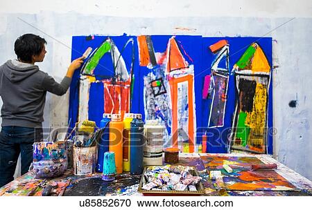 Artist painting on canvas View Large Photo Image Stock Image - Artist painting on canvas. Fotosearch