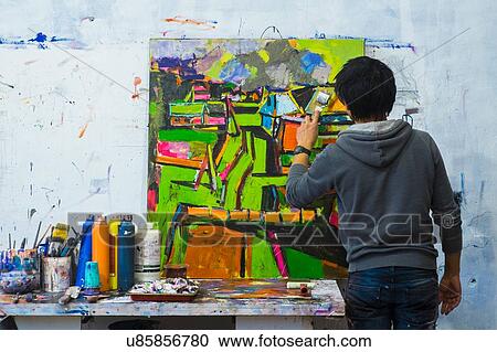 Artist painting on canvas View Large Photo Image Stock Image - Artist painting on canvas. Fotosearch