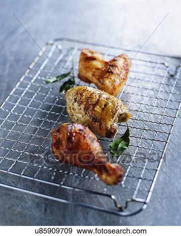 Barbecued chicken leg, thigh and wing, bay leaves View Large Photo Image Stock Photo - Barbecued chicken leg, thigh and wing, bay leaves. Fotosearch