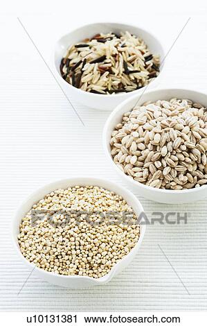 Stock Image - Barley, rice and quinoa in bowls. Fotosearch