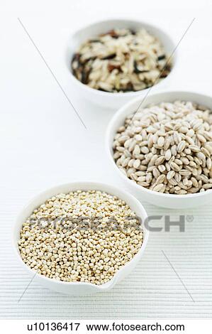 Stock Photo - Barley, rice and quinoa in bowls. Fotosearch