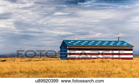 Stock Photo - Barn in field painted with stars and stripes, California, USA. Fotosearch