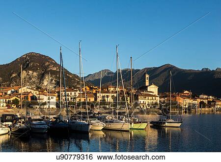 Stock Photograph - Boats in harbour, Feriolo, Lake Maggiore, Piedmont, Lombardy, Italy. Fotosearch