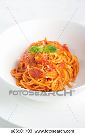Bowl of spaghetti al pomodoro with basil garnish View Large Photo Image Stock Image - Bowl of spaghetti al pomodoro with basil garnish. Fotosearch