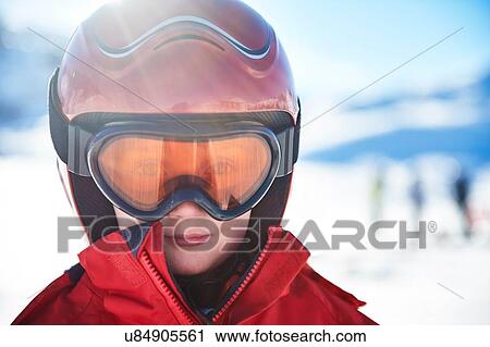 Stock Image - Boy on skiing holiday. Fotosearch