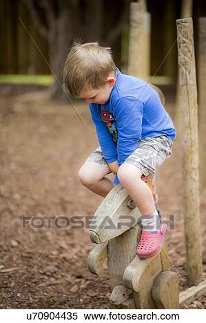 Stock Photography - Boy playing in the park. Fotosearch