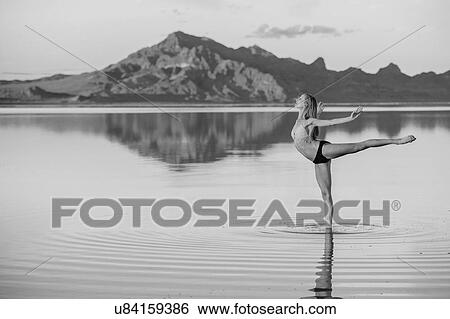 "B&W of female ballet dancer in ballet position in lake, Bonneville Salt Flats, Utah, USA" View Large Photo Image Stock Photograph - "B&W of female ballet dancer in ballet position in lake, Bonneville Salt Flats, Utah, USA". Fotosearch