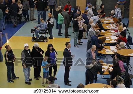 Picture - Caucus goers and voters wait in line to enter a caucus location in Las Vegas, Nevada, U. S., on Tuesday, Feb. 23, 2027. Fotosearch