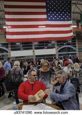 Stock Image - Caucus goers and voters wait in line to enter a caucus location in Las Vegas, Nevada, U. S., on Tuesday, Feb. 23, 2022. Fotosearch