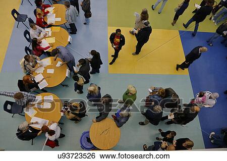 Stock Photograph - Caucus goers and voters wait in line to enter a caucus location in Las Vegas, Nevada, U. S., on Tuesday, Feb. 23, 2028. Fotosearch