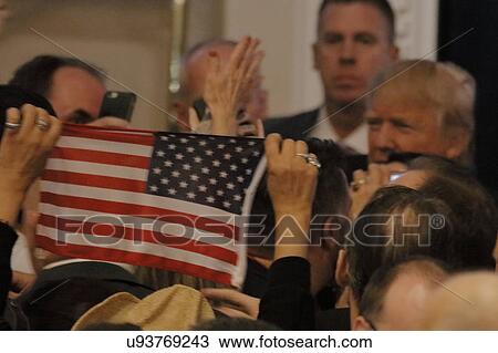 Stock Image - Caucus goers wait in line to enter a caucus location in Las Vegas, Nevada, U. S., on Tuesday, Feb. 23, 2016. Fotosearch