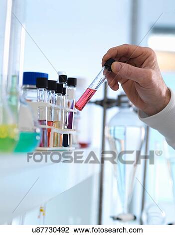 Chemist preparing chemical formula for testing in laboratory View Large Photo Image Stock Image - Chemist preparing chemical formula for testing in laboratory. Fotosearch