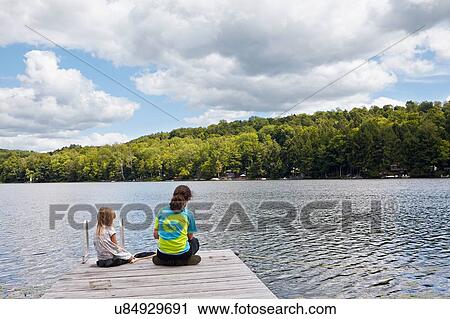 "Children fishing on pier by lake, New Milford, Pennsylvania, US" View Large Photo Image Stock Image - "Children fishing on pier by lake, New Milford, Pennsylvania, US". Fotosearch