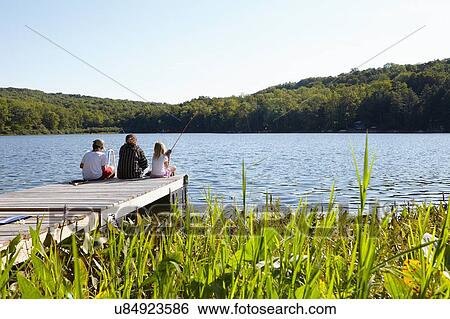 "Children fishing on pier by lake, New Milford, Pennsylvania, US" View Large Photo Image Stock Photograph - "Children fishing on pier by lake, New Milford, Pennsylvania, US". Fotosearch