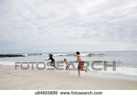 "Children running on beach, Holgate, New Jersey, USA" View Large Photo Image Stock Photo - "Children running on beach, Holgate, New Jersey, USA". Fotosearch